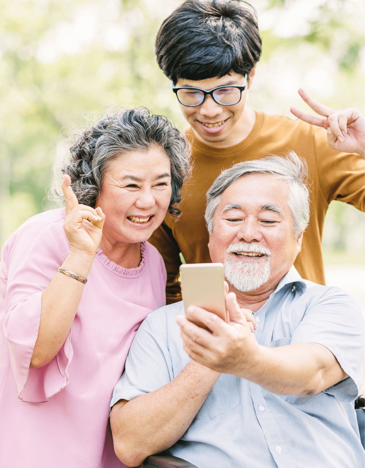 Older couple and family member using a smartphone to manage home care services and online payments.