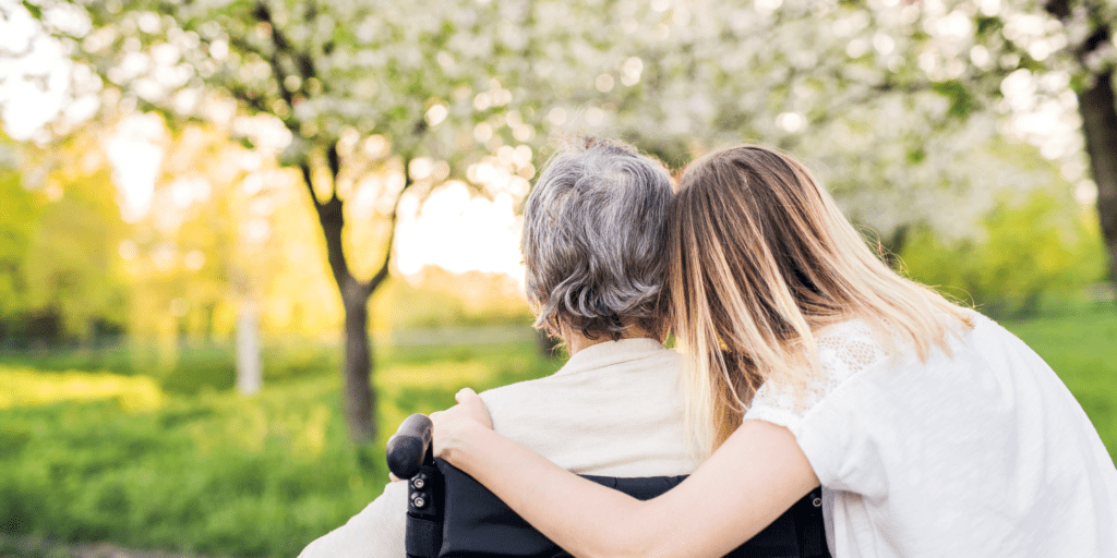 Family caregiver spending quality time with an older adult receiving respite care.
