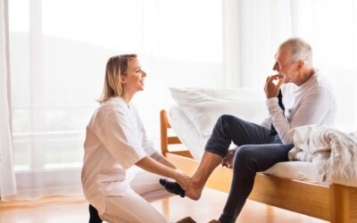 Professional caregiver assisting an older adult with personal care at home in Eaton Rapids, Michigan.