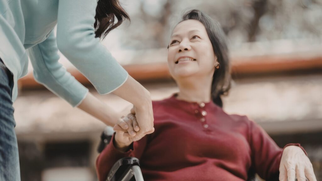 Caregiver providing personal care and mobility assistance to a senior in Eaton Rapids, MI.